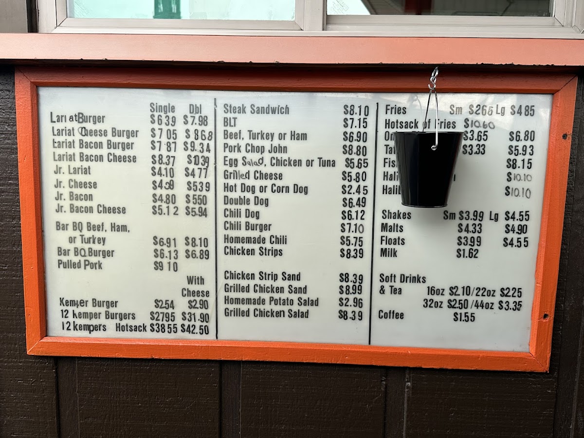 The hand-lettered menu board at the Lariat Bar-B-Q walk-up window